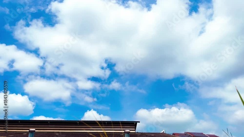Technology and Environment, Roof Ventilators on the Roof of Market, Solar Panels on Sloped Roof on Cloudy Blue Sky Background at Bangkok, Thailand. 06 SEP 2025, A.M./ Real Time Video