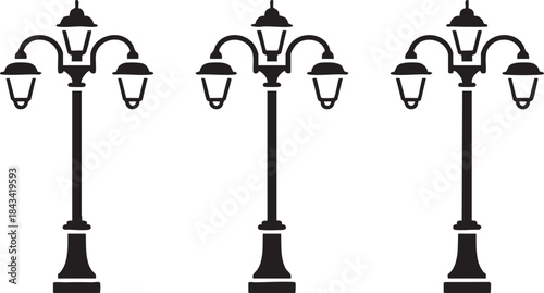 Three Black Street Lamps with Multiple Lights on White Background