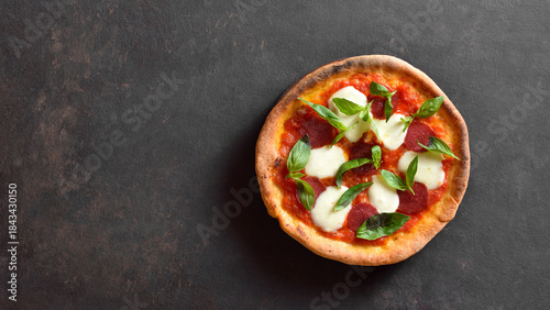 Tableau sur toile Pizza with mozzarella, pepperoni, tomato sauce and basil