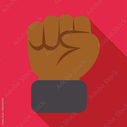 Human hand forming a brown fist with a long shadow on a red background