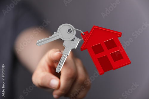 A hand presenting keys with...