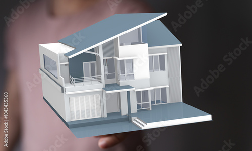 A hand holds a 3D model of ...