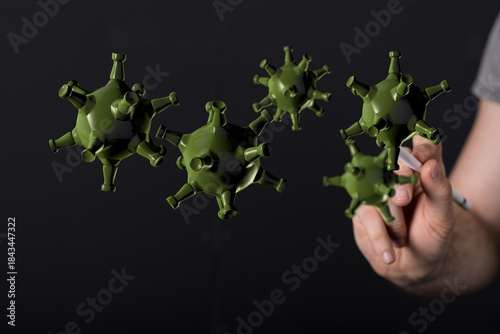 Hand holding syringe with c...