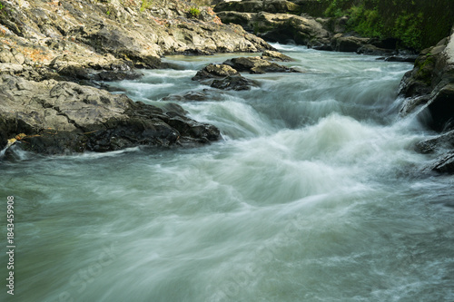 Beauty nature river flow on pillow lava volcanic rocks in Yogyakarta, Indonesia