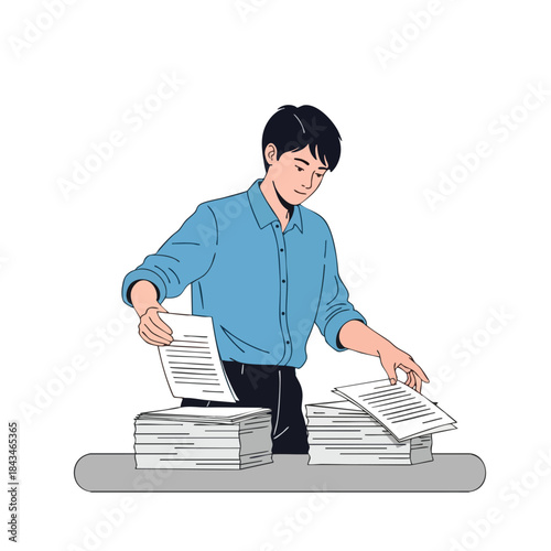 A person in a blue shirt sorts paperwork on a gray desk, with stacks of documents