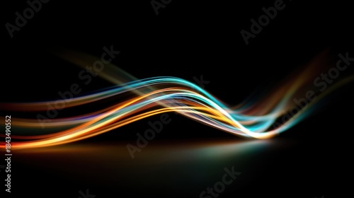 A colorful wave of light is displayed on a black background. The colors are bright and vibrant, creating a sense of energy and movement. The image is abstract and artistic