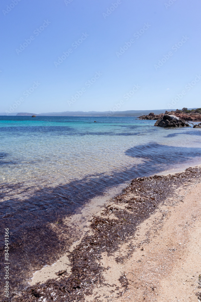 custom made wallpaper toronto digitalRocks and water on the beach of San Silverio, Sardinia, Italy.