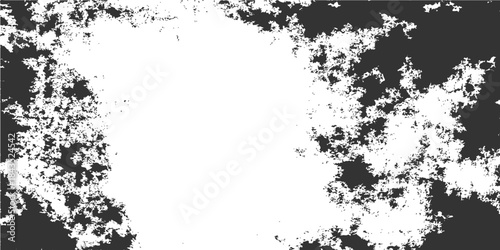 Abstract black and white grunge background featuring a vintage ink splash texture with a floral silhouette border and paint splatter design on a dirty paper vector illustration