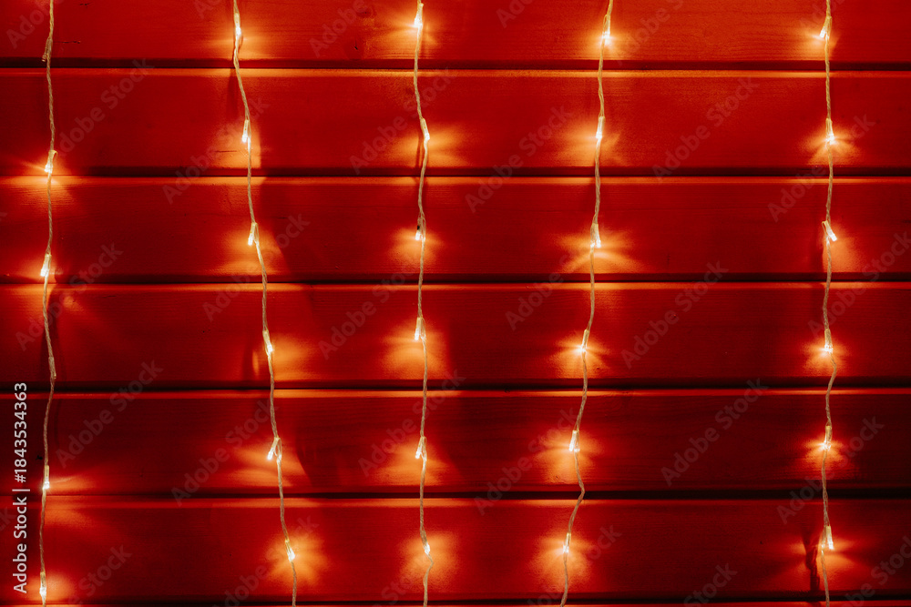 Ταπετσαρία Garland on red wall, minimalist Christmas background and texture