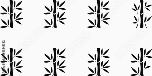 Elegant black bamboo stalks and leaves composition silhouetted against a clean white background