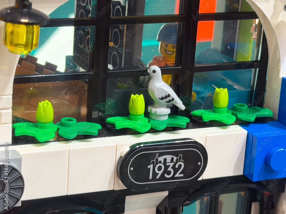 Naklejka premium Colorful lego building with bird and flowers