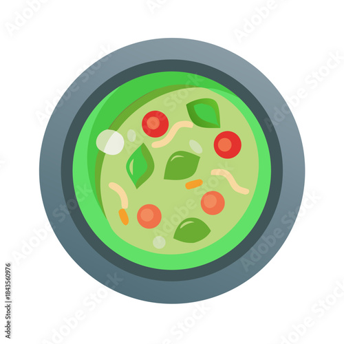 Bowl of vibrant green soup with fresh toppings overhead