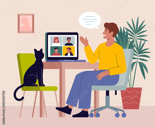A man enjoys a video call while working from home with his black cat beside him, creating a cozy and productive atmosphere. The scene reflects modern remote work culture and pet companionship.