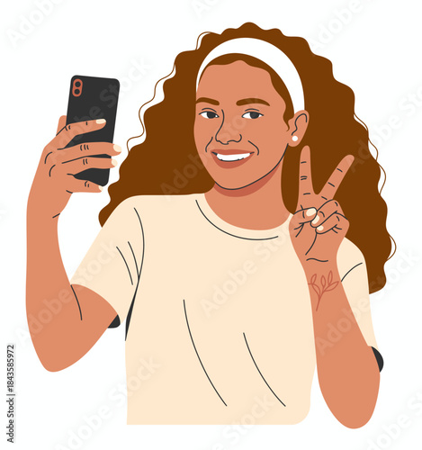 A joyful girl captures her excitement in a selfie with a smartphone, showcasing her bright smile and peace sign, embodying the essence of youthful energy and modern social interaction.