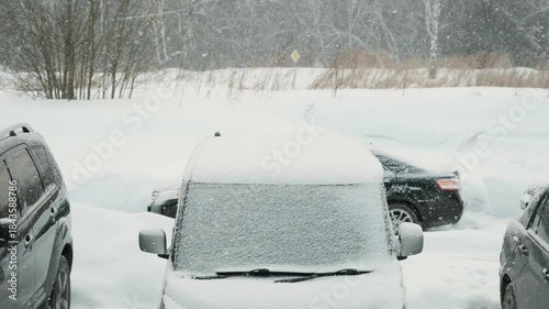 Wallpaper Mural Snow falling against a backdrop of parked cars 
 Torontodigital.ca