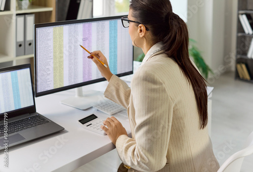 Photos Business accountant conducts audit and analysis of data