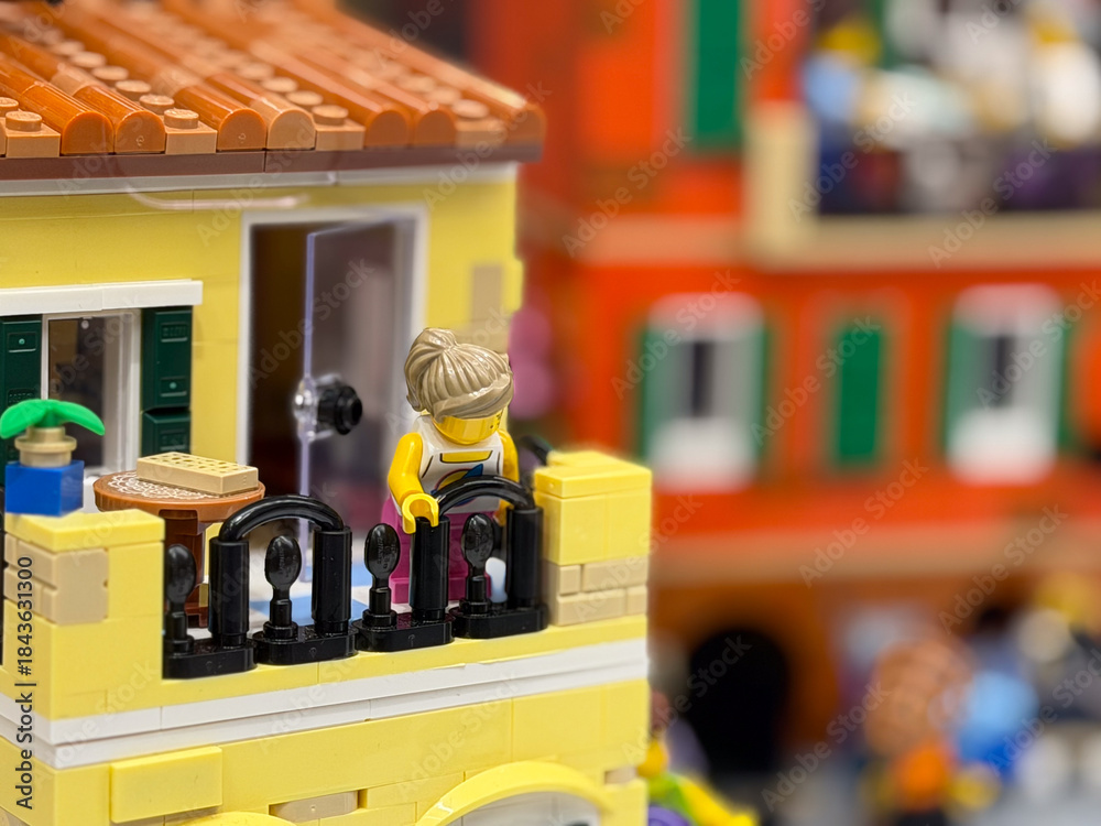 Fototapeta premium Colorful lego building with balcony and figure
