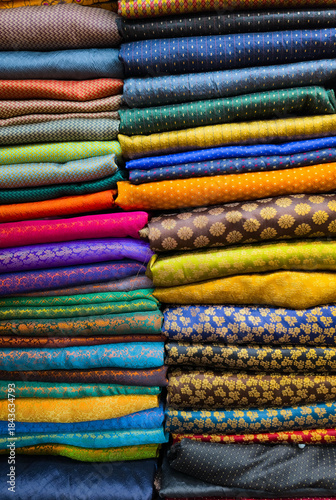 Multi Coloured Catalogue of Clothing Materials and Designs background