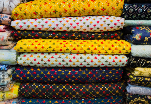 Multi Coloured Catalogue of Clothing Materials and Designs background