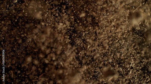 Super Slow Motion Shot of Exploding Soil Towards Camera at 1000fps.