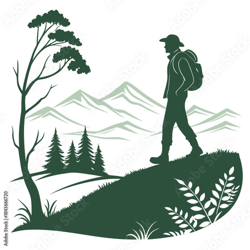 Hiker walking on a hill overlooking distant mountains