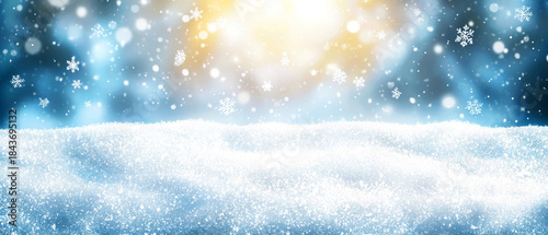 Beautiful winter scene with fresh snow, falling snowflakes, and a bright, magical blue-to-gold bokeh light background