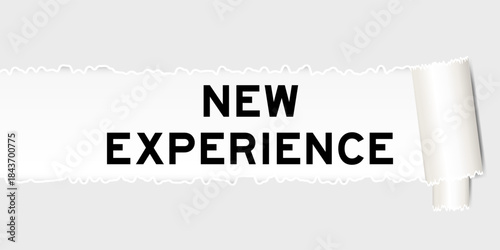 Ripped gray paper background that have word new experience under torn part