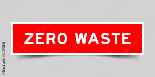 Red color square shape sticker label with word zero waste on gray background