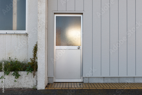 sidewalk by street wall  and  door