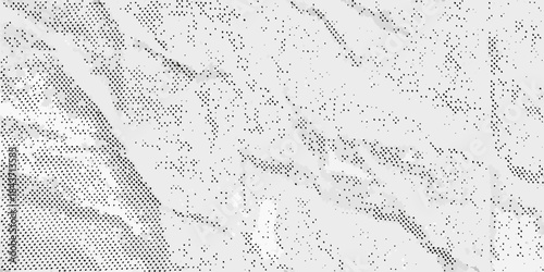 Abstract grayscale texture with subtle patterns and a grainy mottled appearance