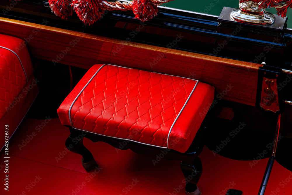 Naklejka premium Luxurious red leather seat in elegant gondola interior design