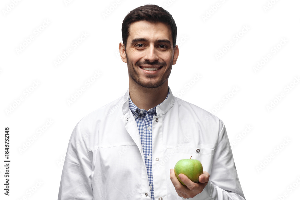 Fototapeta premium Portrait of smiling dentist holding green apple