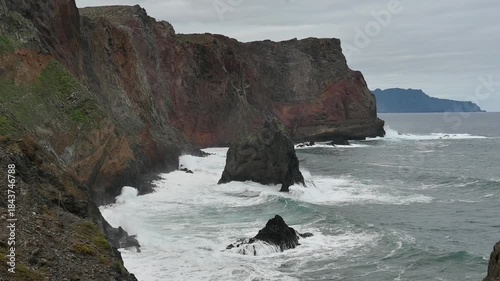 big waves of the atlantic ocean splashing on the cliff coast of east Madeira, along the famous PR8 Vereda da Ponta de São Lourenço hiking trail