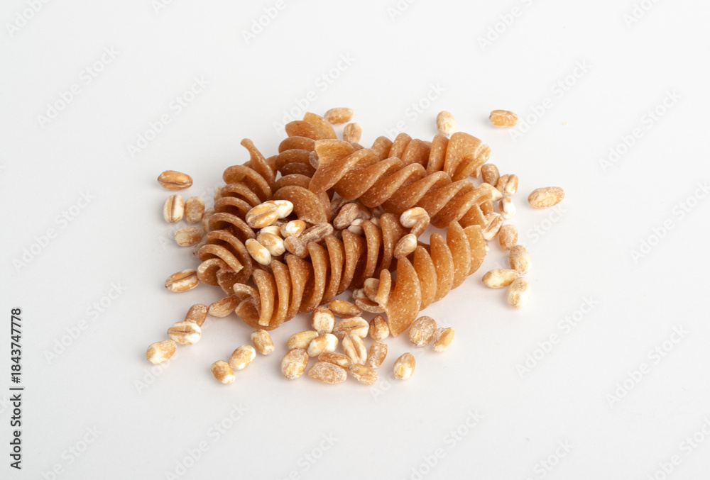 Obraz premium Raw Brown Pasta, Wholegrain Fusilli, Dry Whole Grain Noodle, Raw Spelt Macaroni, Healthy Italy Food