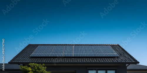 solar panels installed on a black tiled pitched roof minimal technology