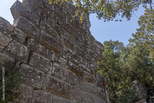 Ruins of the city of Termessos. An ancient city located high in the mountains of Turkey. The walls of the buildings in the ancient city are made of huge stone blocks. Masonry of ancient buildings.