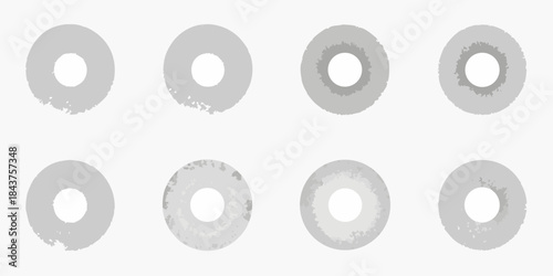 A series of grayscale ring shapes with varying textures and central holes