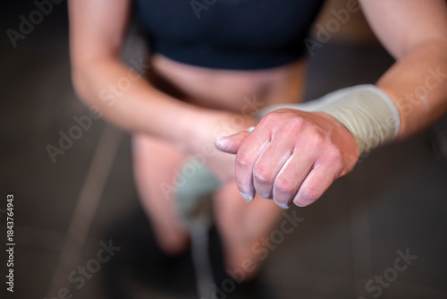 Strong Female Lifter, Athletic Woman Primes Silently, White Female Athlete Focuses Quietly On Gripping Heavy Weights, Determined Female Weightlifter With Chalked Palms Prepares For Challenging Lift