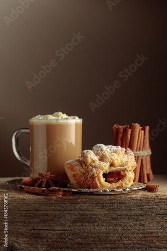 Photography Vienna strudel and caffe latte on a silver tray.