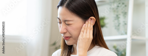 ear problem concept, Young woman touching her ear feel pain from inflammation. Free Download ear problem concept, Young woman touching her ear feel pain from inflammation. - GFXLoad
