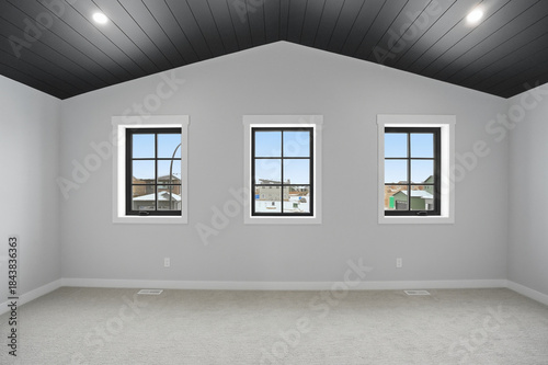 Room with three windows and a black ceiling