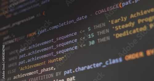 Close up video of scrolling abstract SQL game development code