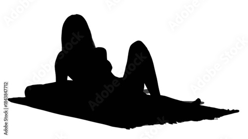 Woman standing with a bicycle on a sunny street.