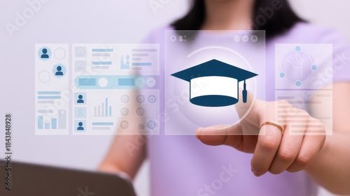 Digital Learning Touch: A person's hand interacts with a digital display featuring a mortarboard icon, symbolizing education and academic pursuits in a modern, interactive way.