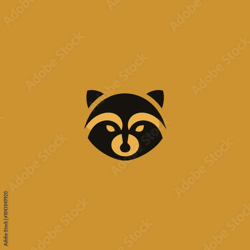 Minimalist black raccoon face icon on a mustard yellow background. Simple stylized graphic illustration of a masked wild animal.