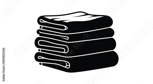 A neatly stacked pile of folded clothes presented in a striking black silhouette