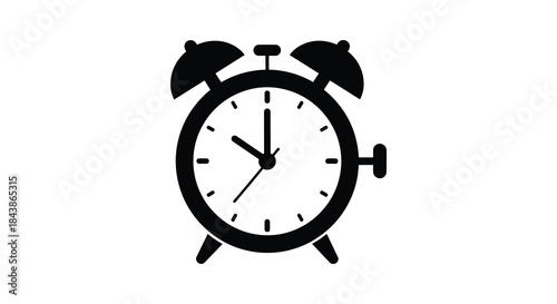 A striking black clock face displaying ten o clock presented as a bold silhouette