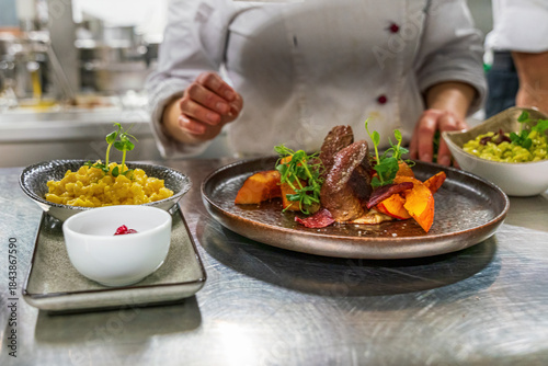 Wallpaper Mural A chef at a professional restaurant kitchen prepare the ordered food before it leave to the guest room Torontodigital.ca