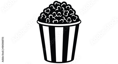 A black and white striped container filled with fluffy popcorn a delightful snack silhouette
