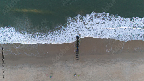 Fototapeta Naklejka Na Ścianę i Meble -  Aerial view of the ocean. Beach town. Coastal town. Ocean view. Beach and ocean. Summer sunset ocean from the sky. Waves of the ocean. Ocean waves. Ocean background. Sea waves. Ocean shot. 